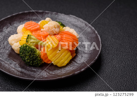 Delicious fresh vegetables steamed carrots, broccoli, cauliflower Delicious fresh vegetables steamed carrots, broccoli, cauliflower 123275299