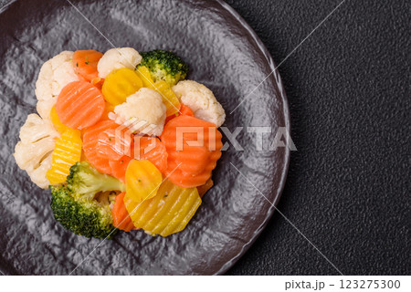 Delicious fresh vegetables steamed carrots, broccoli, cauliflower Delicious fresh vegetables steamed carrots, broccoli, cauliflower 123275300