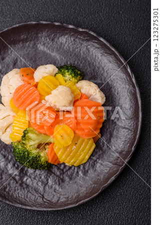 Delicious fresh vegetables steamed carrots, broccoli, cauliflower Delicious fresh vegetables steamed carrots, broccoli, cauliflower 123275301