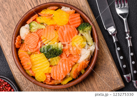 Delicious fresh vegetables steamed carrots, broccoli, cauliflower Delicious fresh vegetables steamed carrots, broccoli, cauliflower 123275330