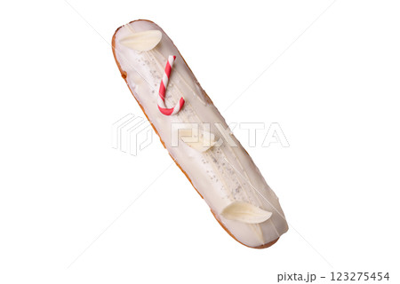 Sweet eclair with chocolate filling covered with white glaze 123275454
