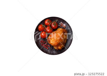 Delicious juicy chicken thighs baked with salt, spices and herbs Delicious juicy chicken thighs baked with salt, spices and herbs 123275522