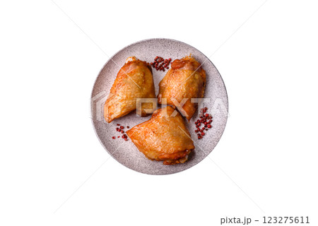 Chicken thighs fried with salt, spices and herbs 123275611