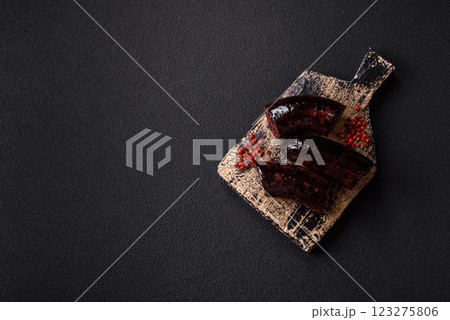 Delicious black blood sausage or black pudding with spices and herbs Delicious black blood sausage or black pudding with spices and herbs 123275806