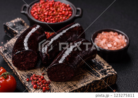Delicious black blood sausage or black pudding with spices and herbs Delicious black blood sausage or black pudding with spices and herbs 123275811