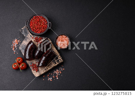 Delicious black blood sausage or black pudding with spices and herbs Delicious black blood sausage or black pudding with spices and herbs 123275815