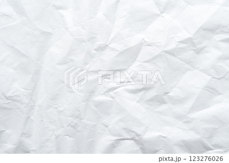 Textured crumpled white paper background with creases and wrinkles Textured crumpled white paper background with creases and wrinkles 123276026