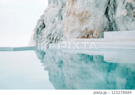 Inviting crystal clear outdoor thermal baths nestled among white rocks offer a luxurious and relaxing spa experience 123278884