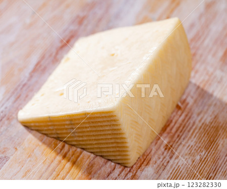 Piece of fresh semi-soft cheese Piece of fresh semi-soft cheese 123282330