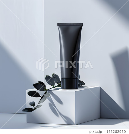 Black lotion tube on white cube. Transparent materials 123282950