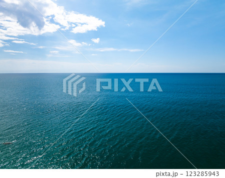 Aerial view of beautiful sea in summer season sky background,Drone view Waves water surface texture on sunny tropical ocean in Phuket island Thailand 123285943
