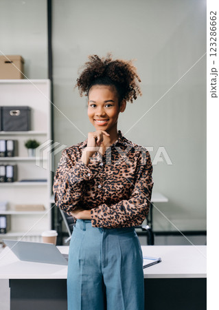 Modern business african woman in the office with copy space Modern business african woman in the office with copy space 123286662