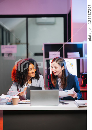 Kind leader executive manager share and discuss business solutions plan ideas on tablet with female marketing manager Kind leader executive manager share and discuss business solutions plan ideas on tablet with female marketing manager 123287298