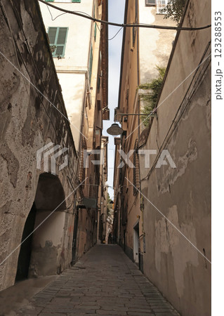 Traditional buildings, pedestrianized narrow streets of old town. Genoa and the medieval architecture of Italy. Windows, arches and doors. Traditional buildings, pedestrianized narrow streets of old town. Genoa and the medieval architecture of Italy. Windows, arches and doors. 123288553