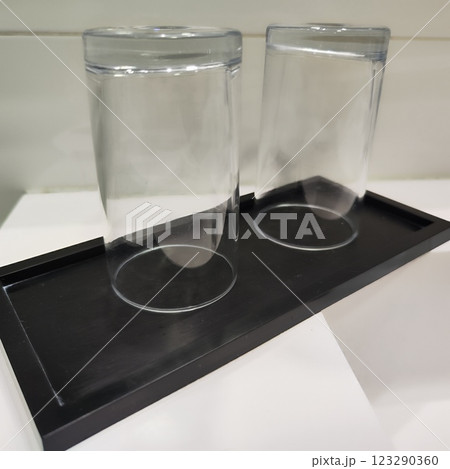 Clear glass cups bathroom stand on sink Clear glass cups bathroom stand on sink 123290360