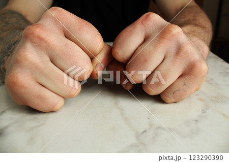 fists on the table. The concept of domestic violence 123290390