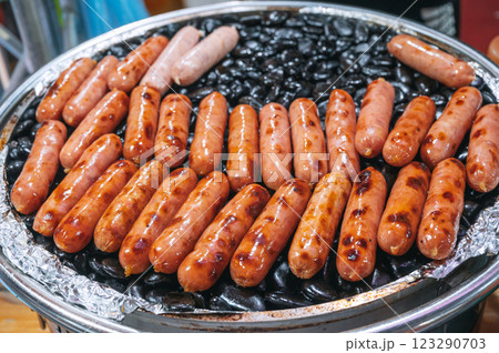 Grilled sausages on rocks at Asian night market. Street fast food in Asia in Vietnam 123290703