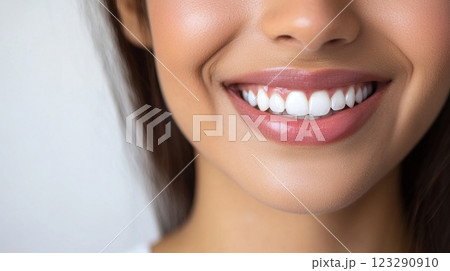 Radiant Smile: Close-up of a woman's perfect teeth, bright and beautiful, showcasing excellent oral hygiene with pink lips and healthy gums. Radiant Smile: Close-up of a woman's perfect teeth, bright and beautiful, showcasing excellent oral hygiene with pink lips and healthy gums. 123290910