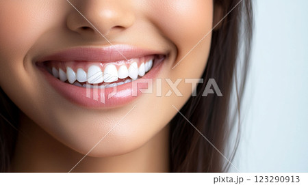 Radiant smile featuring perfectly aligned teeth and healthy gums, showcasing optimal dental care and hygiene for a confident, attractive appearance. 123290913