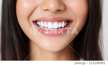 Radiant smile showcasing healthy, straight, and perfectly aligned teeth, complemented by soft, natural-looking lips and glowing skin. Radiant smile showcasing healthy, straight, and perfectly aligned teeth, complemented by soft, natural-looking lips and glowing skin. 123290991