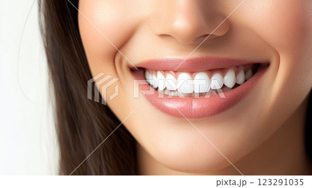 Close-up of a radiant smile showcasing healthy teeth. The image focuses on the aesthetics of dental care and oral hygiene. Close-up of a radiant smile showcasing healthy teeth. The image focuses on the aesthetics of dental care and oral hygiene. 123291035