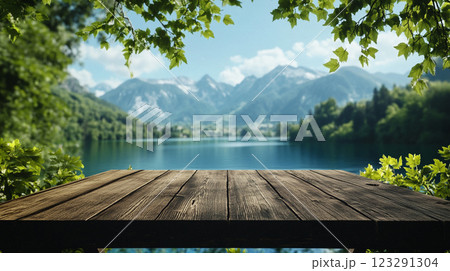 Picturesque mountain lake view with wooden table, perfect for product display or peaceful scenery backgrounds. Tranquil nature escape. 123291304