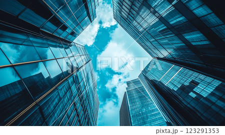 Skyward Gaze: Abstract Perspective of Modern Architecture against the Blue Sky and Clouds, Capturing the Essence of Urban Development Skyward Gaze: Abstract Perspective of Modern Architecture against the Blue Sky and Clouds, Capturing the Essence of Urban Development 123291353