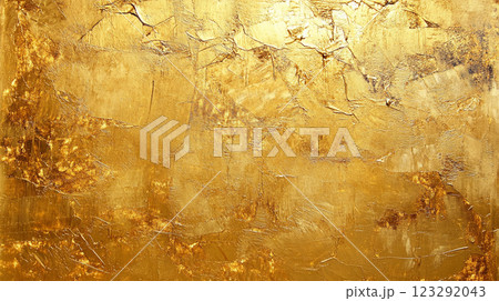 Textured gold surface with light and shadow. Abstract painting with uneven surface, cracks, and crevices adding depth and visual interest. 123292043