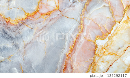 Elegant marble texture featuring a blend of white, peach, and gray tones accentuated with intricate golden vein-like patterns. 123292117
