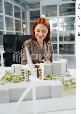 Ginger young woman working in the modern office 123292305