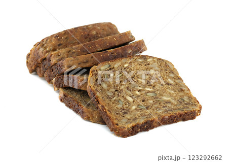 Several slices of dark multigrain bread are stacked, showing off the healthy mix of seeds. Several slices of dark multigrain bread are stacked, showing off the healthy mix of seeds. 123292662