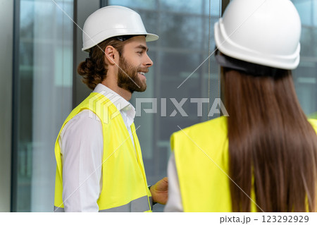 Two engineers working in the office on a new green energy project 123292929