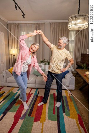 A happy couple spending time at home dancing and having fun 123293619