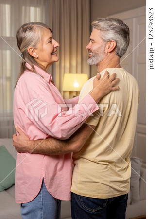 Happy mature couple dancing at home and feeling romantic Happy mature couple dancing at home and feeling romantic 123293623