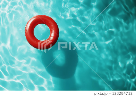 Top view of a red inflatable ring floating in swimming pool on sunny day, top view. Created with Generative AI. 123294712