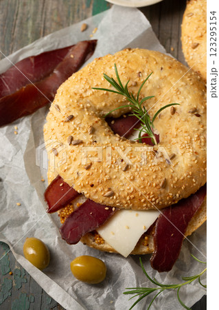 Burger with cheese, basturma and olives 123295154