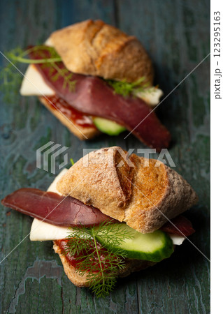 Two small sandwiches with basturma and cucumber 123295163
