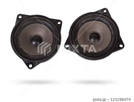 Two speakers of an acoustic system - an audio for playing music in a car interior on a white isolated background in a photo studio. Spare parts for auto repair in a workshop or for sale for tuning Two speakers of an acoustic system - an audio for playing music in a car interior on a white isolated background in a photo studio. Spare parts for auto repair in a workshop or for sale for tuning 123296074