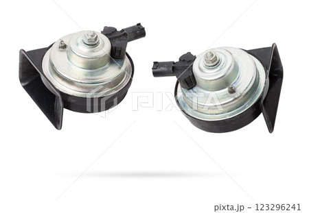 Pair of electric black plastic horns in retro style - car horn on white isolated background in photo studio. Spare part for sale or repair in a workshop, or tuning a buzzer sound in car service. Pair of electric black plastic horns in retro style - car horn on white isolated background in photo studio. Spare part for sale or repair in a workshop, or tuning a buzzer sound in car service. 123296241