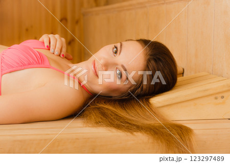 Portrait of woman relaxing in sauna. Spa wellbeing 123297489