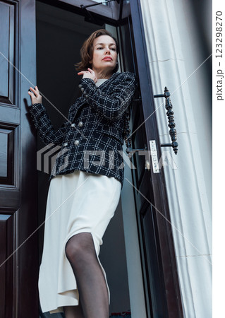 woman of 40 years old on the balcony the door woman of 40 years old on the balcony the door 123298270