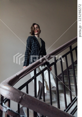 woman 40 years old standing on the stairs woman 40 years old standing on the stairs 123298272