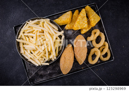Frozen food assortment. Potato hashbrowns and french fries Frozen food assortment. Potato hashbrowns and french fries 123298969