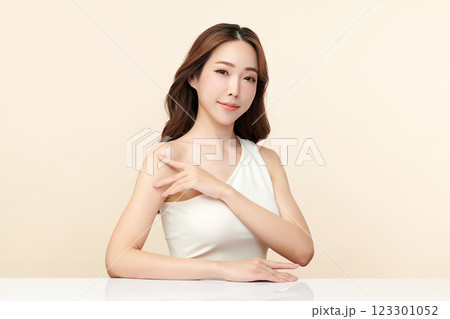 Beautiful young asian woman with clean fresh skin on beige background, Face care, Facial treatment, Cosmetology, beauty and spa, Asian women portrait. Beautiful young asian woman with clean fresh skin on beige background, Face care, Facial treatment, Cosmetology, beauty and spa, Asian women portrait. 123301052