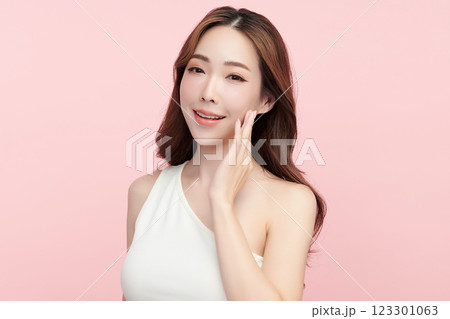 Beautiful young asian woman with clean fresh skin on pink background, Face care, Facial treatment, Cosmetology, beauty and spa, Asian women portrait. Beautiful young asian woman with clean fresh skin on pink background, Face care, Facial treatment, Cosmetology, beauty and spa, Asian women portrait. 123301063