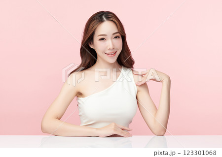 Beautiful young asian woman with clean fresh skin on pink background, Face care, Facial treatment, Cosmetology, beauty and spa, Asian women portrait. 123301068
