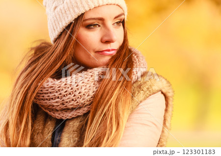 Woman walking in park during autumn Woman walking in park during autumn 123301183