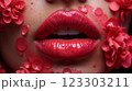 Close-up of beautiful aesthetic lips with red lipstick filled with decorative flowers around, sexy and sensual 123303211