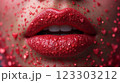 Close-up of beautiful aesthetic lips with red lipstick filled with decorative hearts around, sexy and sensual atmosphere 123303212
