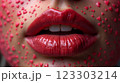 Close-up of beautiful aesthetic lips with red lipstick filled with decorative hearts around, sexy and sensual atmosphere 123303214